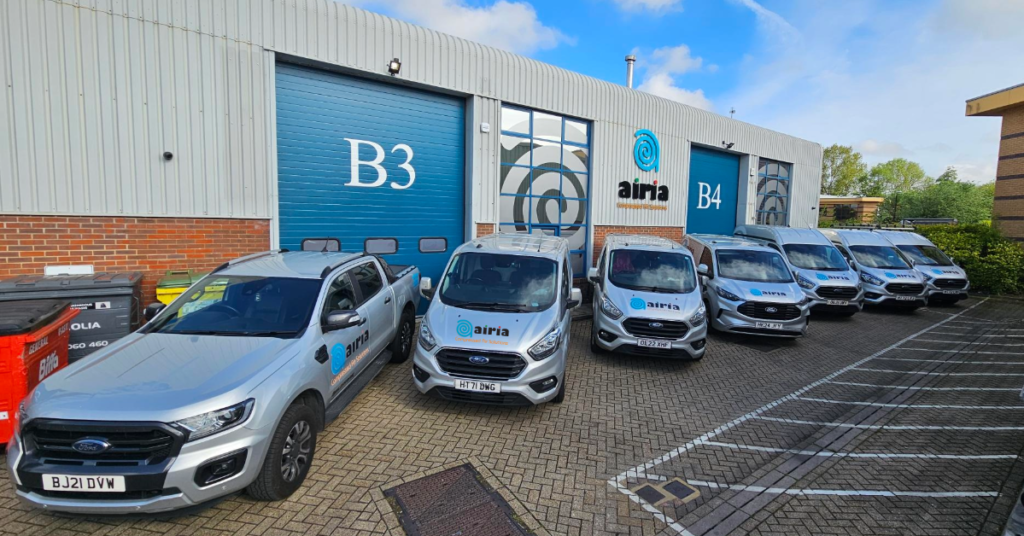 Airia branded vans outside of Airia offices in Southampton